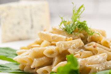 Image showing Italian pasta penne gorgonzola and pine nuts