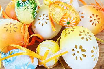 Image showing Bright color easter eggs with bows