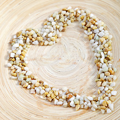 Image showing Pebble heart on earthenware