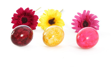 Image showing Three colourful Easter Eggs with flowers