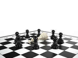 Image showing The white chess king lies surrounded by black chess pawns on a chessboard