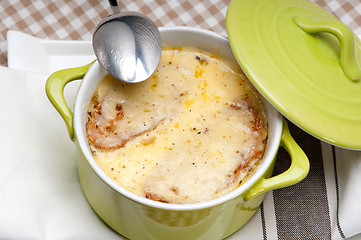 Image showing onion soup with melted cheese and bread on top