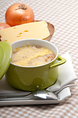 Image showing onion soup with melted cheese and bread on top