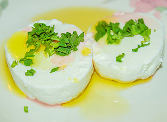 Image showing Tomino cheese with rucola and olive oil