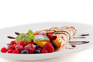 Image showing fresh tasty homemade crepe pancake and fruits