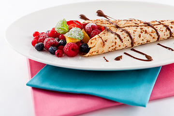 Image showing fresh tasty homemade crepe pancake and fruits