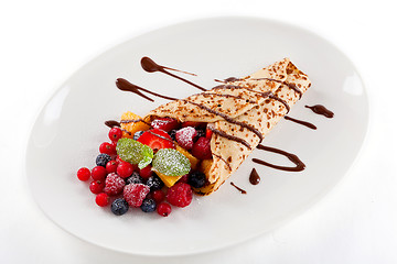 Image showing fresh tasty homemade crepe pancake and fruits