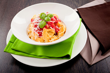 Image showing tasty fresh homemade ravioli and tomato sauce