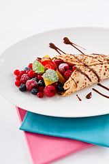 Image showing fresh tasty homemade crepe pancake and fruits