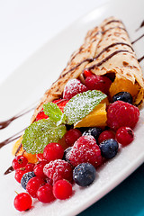 Image showing fresh tasty homemade crepe pancake and fruits