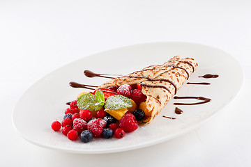 Image showing fresh tasty homemade crepe pancake and fruits