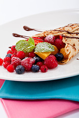 Image showing fresh tasty homemade crepe pancake and fruits
