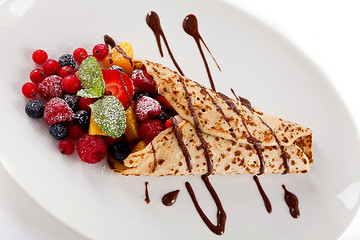 Image showing fresh tasty homemade crepe pancake and fruits