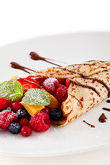 Image showing fresh tasty homemade crepe pancake and fruits