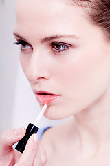 Image showing woman applying lipstick on lips natural beauty