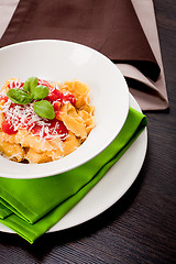 Image showing tasty fresh homemade ravioli and tomato sauce