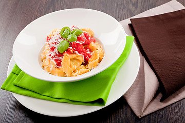 Image showing tasty fresh homemade ravioli and tomato sauce