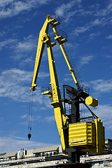 Image showing house sky clouds and yellow crane 