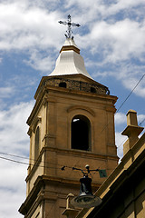 Image showing the yellow brick tower facade street lamp 