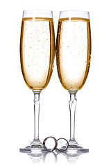 Image showing Champagne and wedding rings