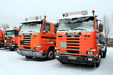 Image showing Row of Orange Scania Trucks