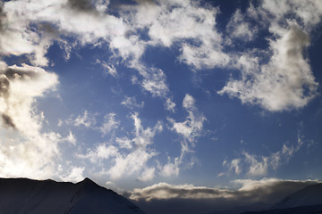 Image showing Blue sky with clouds and mountains in evening