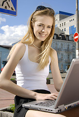 Image showing woman with laptop in a hi-tech urban surrounding