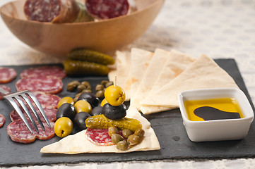 Image showing cold cut platter with pita bread and pickles