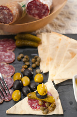 Image showing cold cut platter with pita bread and pickles