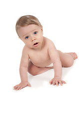 Image showing Baby boy crawling in studio isolated on white