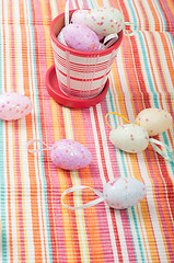 Image showing Easter eggs and striped napkin