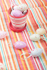 Image showing Striped napkin and easter eggs