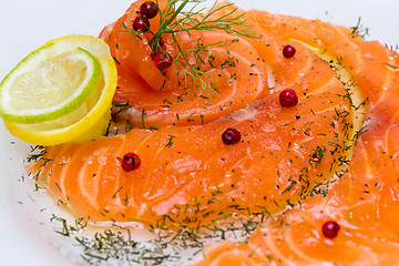 Image showing Salmon carpaccio with pink pepper