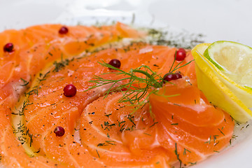 Image showing Salmon carpaccio with pink pepper