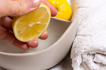 Image showing Pressed lemon in wellness