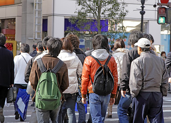 Image showing Teenagers crossing the street