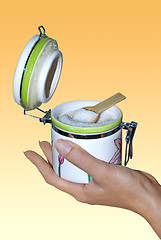 Image showing sugar bowl on hand with path