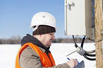 Image showing Electrical engineer inspect electric lines  technical quality