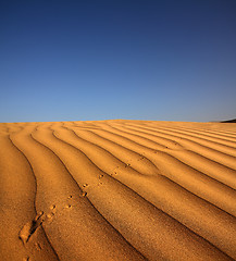 Image showing footprint on sand dune in desert