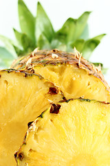 Image showing ripe pineapple with slices