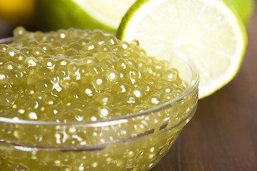 Image showing tapioca pearls with lime. white bubble tea ingredients