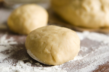 Image showing Dough on wooden board