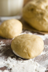 Image showing Dough on wooden board