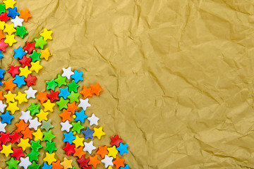 Image showing Multicolored stars on a background of crumpled paper