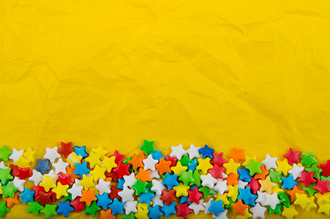 Image showing Multicolored stars on a background of crumpled paper