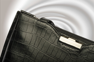 Image showing A black business handbag isolated on a graduated background