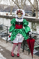 Image showing Disguised Person with a Red Umbrella