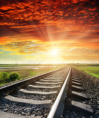 Image showing railroad to red sunset