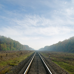 Image showing railway goes to horizon in fog