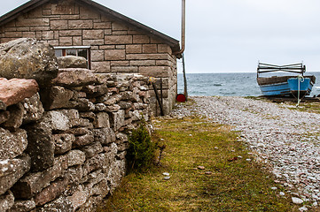 Image showing Blue boat on shore